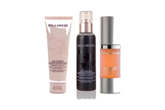 Detergente viso, Sublime-Essence e siero BIO ET CAROUBE su sfondo bianco