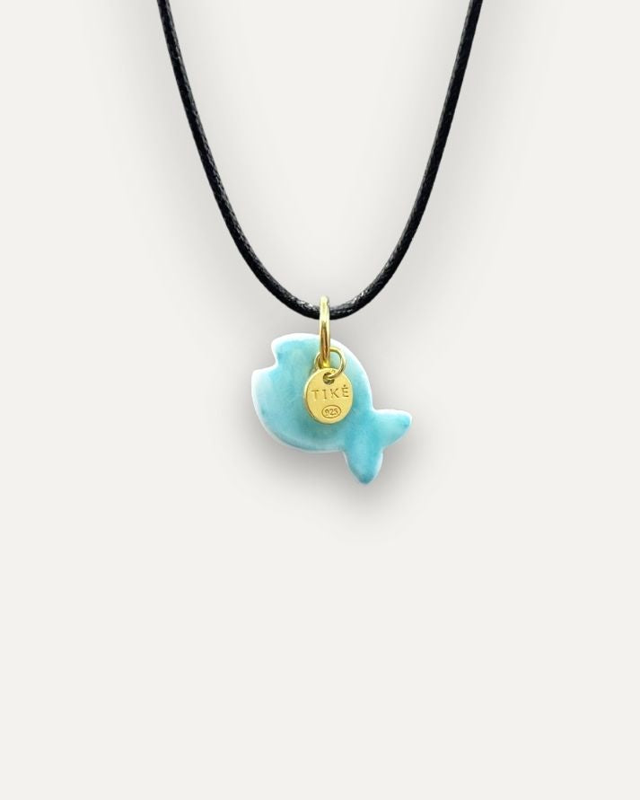 Solid turquoise fish porcelain charm