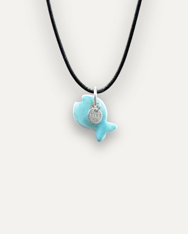 Solid turquoise fish porcelain charm
