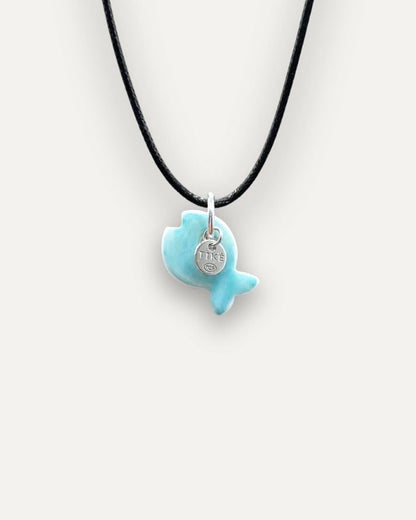 Solid turquoise fish porcelain charm