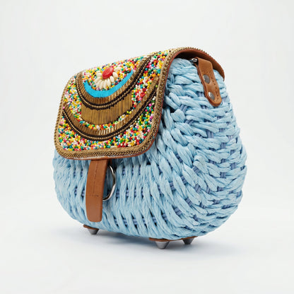 Bolsa transversal de ráfia trançada