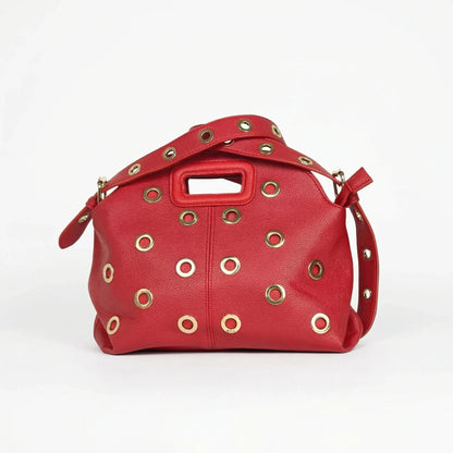 Bolso de hombro con ojales dorados